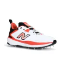 New Balance CK4030F6 in White/Red/Black colorway, showing the 11-spike metal outsole and FuelCell midsole branding.