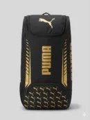 Puma Junior Duffle Cricket Bag in Black/White, showing the sleek vertical design and padded adjustable shoulder straps.